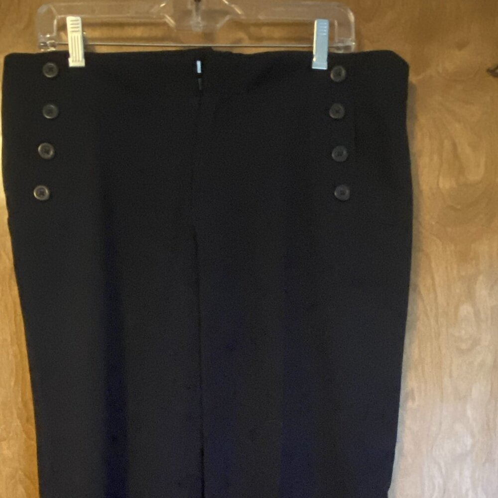 Navy wool trousers with sailor button details on pockets